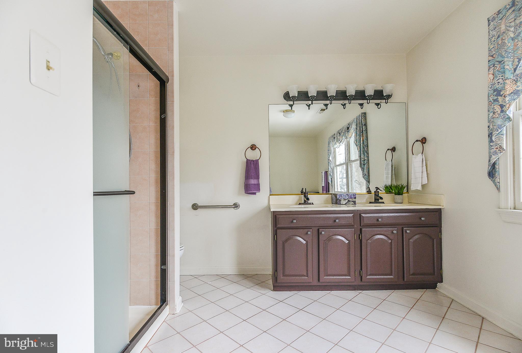 8670 Center Road Springfield, VA 22152 - Photo 17 of 33 Spa-like master bath w/ brushed bronze fixtures