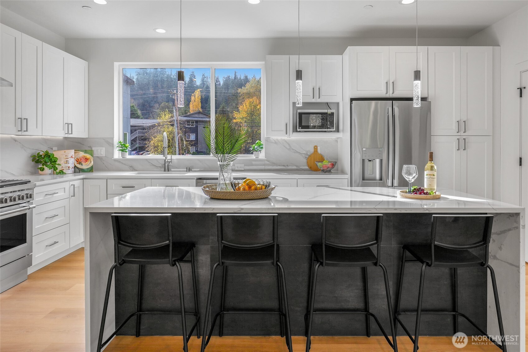 10626 East Riverside Drive Bothell, WA 98011 - Photo 11 of 30 a kitchen with a sink and chairs