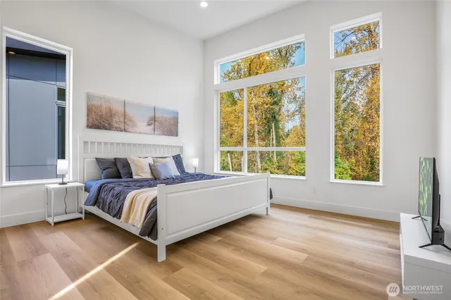 a spacious bathroom with double sink and a bathtub