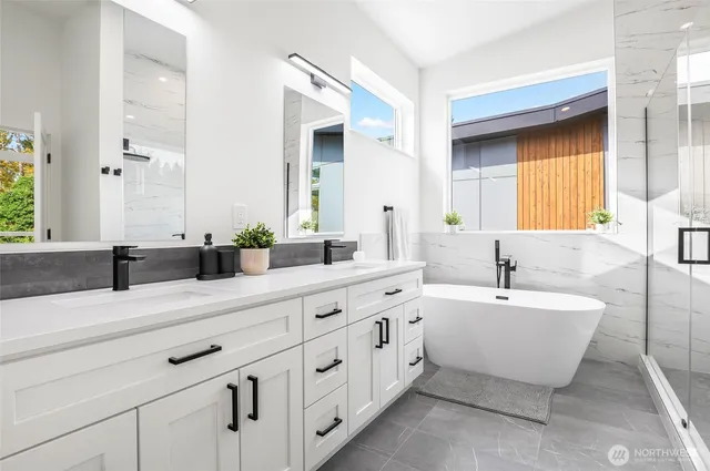 a bathroom with a sink and shower