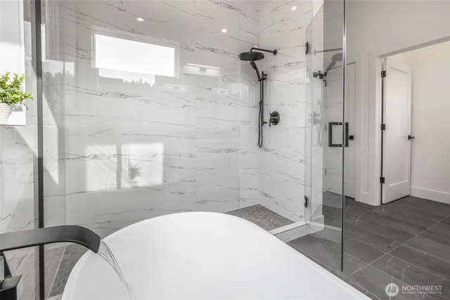 a view of a room with wooden floor and white walls