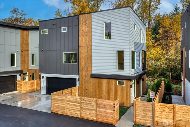 a view of backyard with swimming pool and outdoor seating