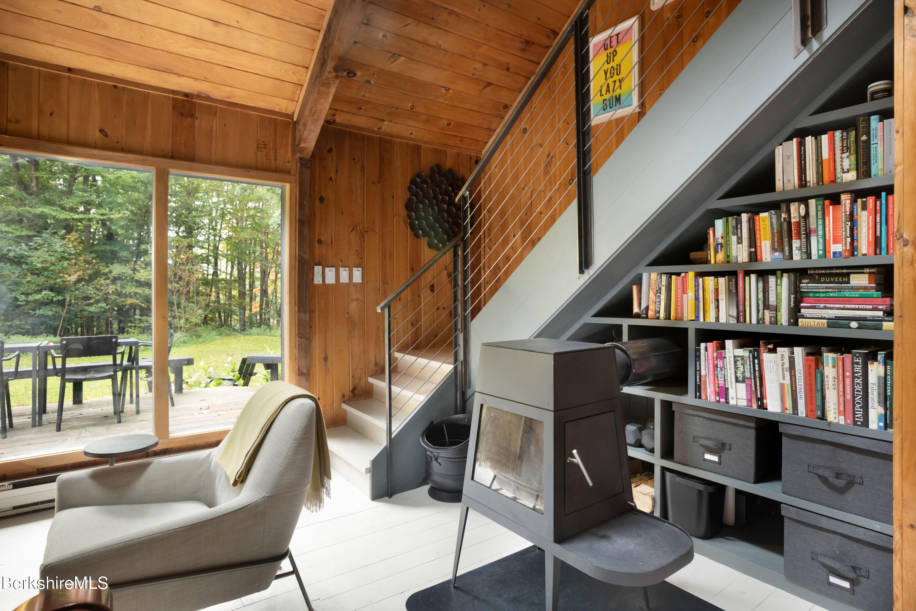 60 New Hartford Road Sandisfield, MA 01255 - Photo 13 of 25 a view of staircase with wooden floor and book shelf