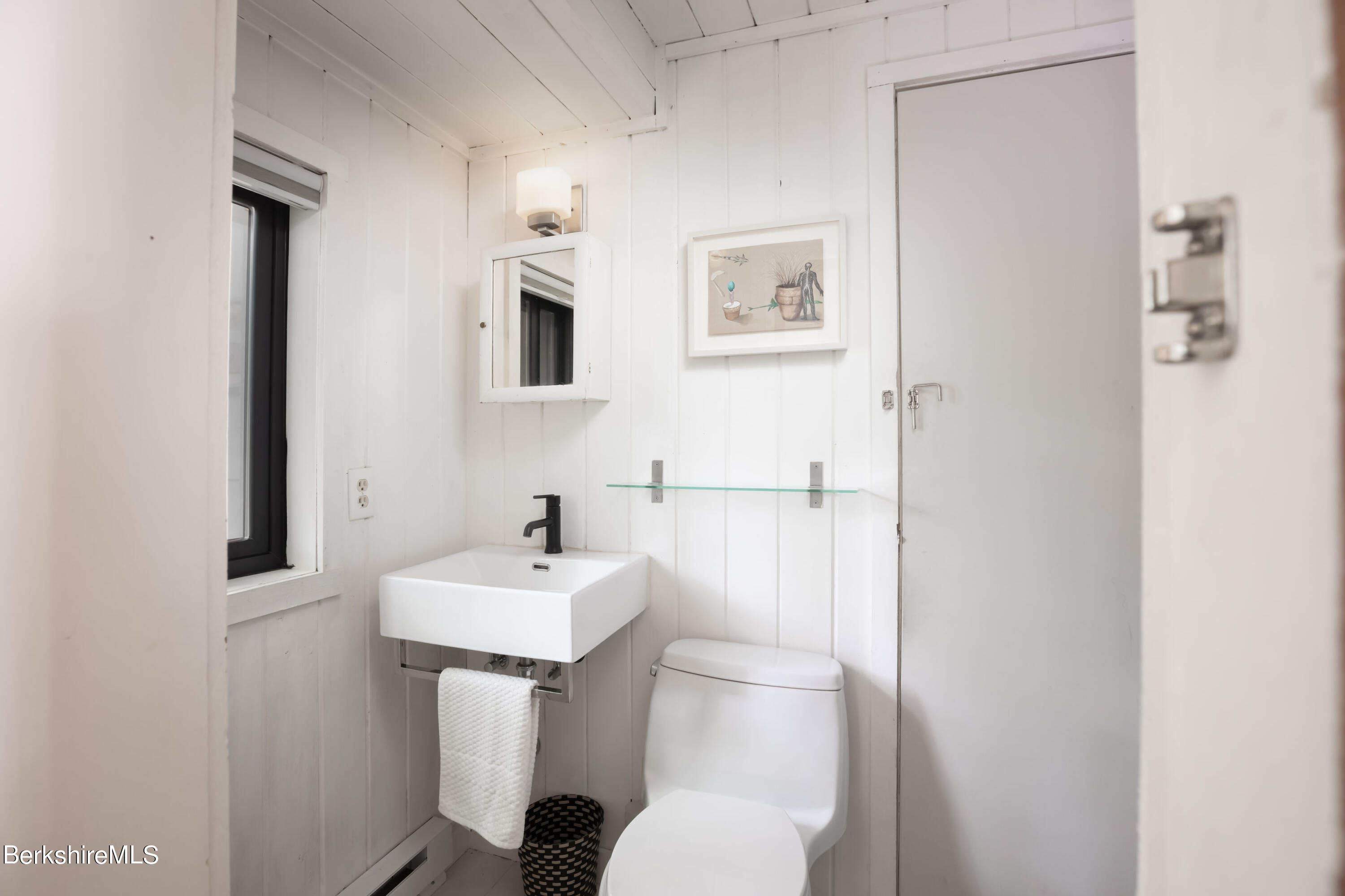 60 New Hartford Road Sandisfield, MA 01255 - Photo 14 of 25 a bathroom with a sink mirror and toilet