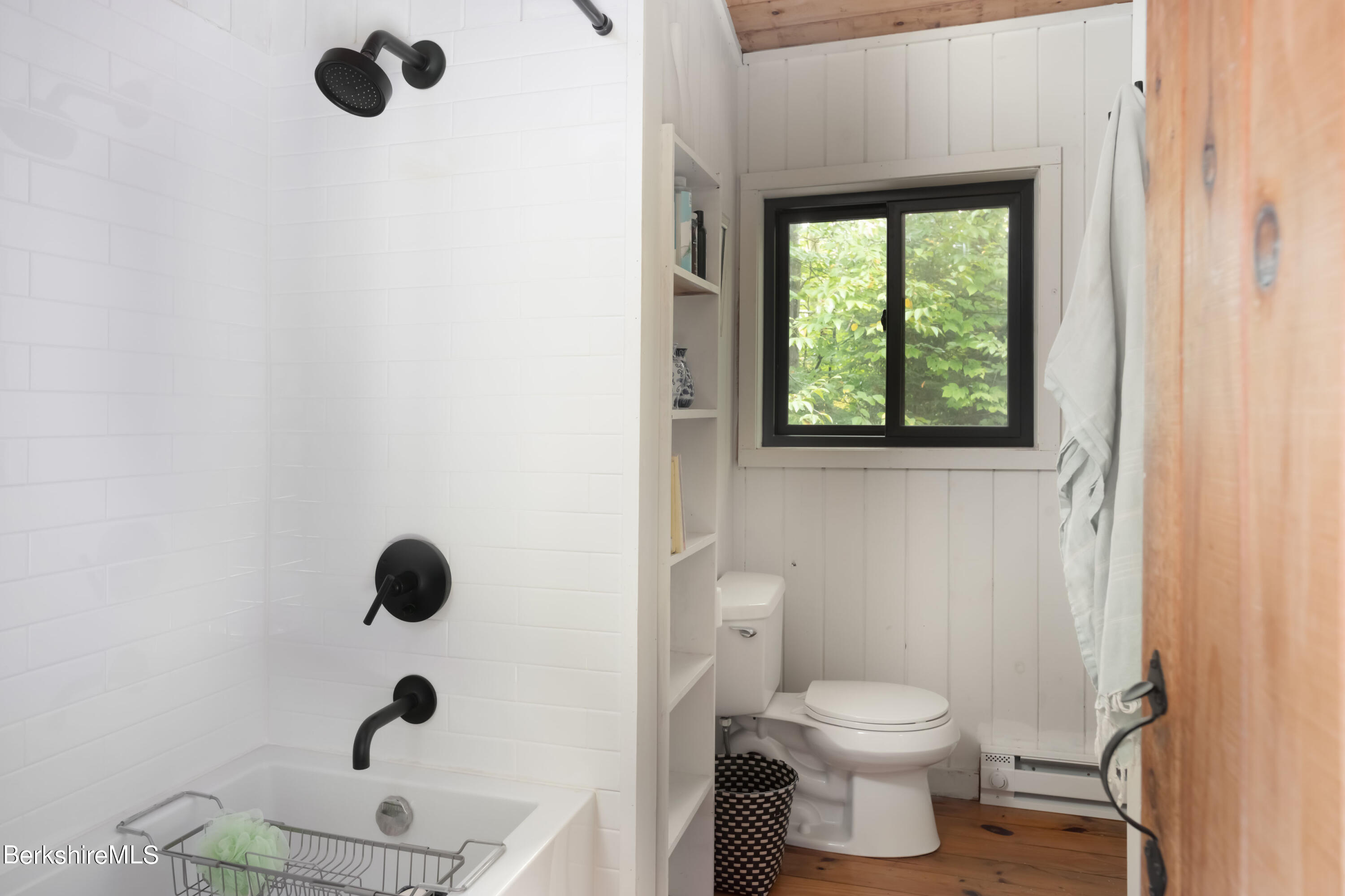 60 New Hartford Road Sandisfield, MA 01255 - Photo 21 of 25 a bathroom with a toilet and a shower curtain