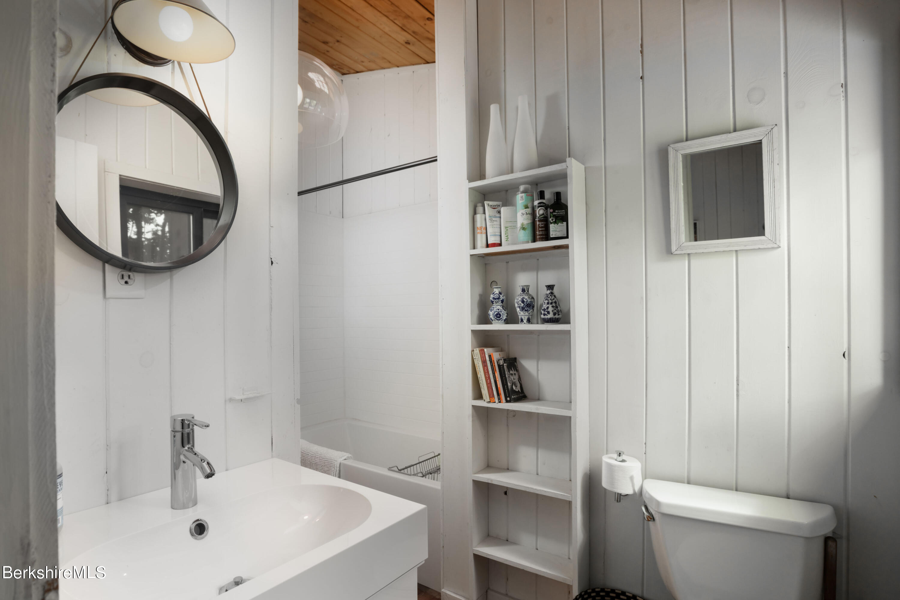 60 New Hartford Road Sandisfield, MA 01255 - Photo 22 of 25 a bathroom with a toilet a sink and a mirror