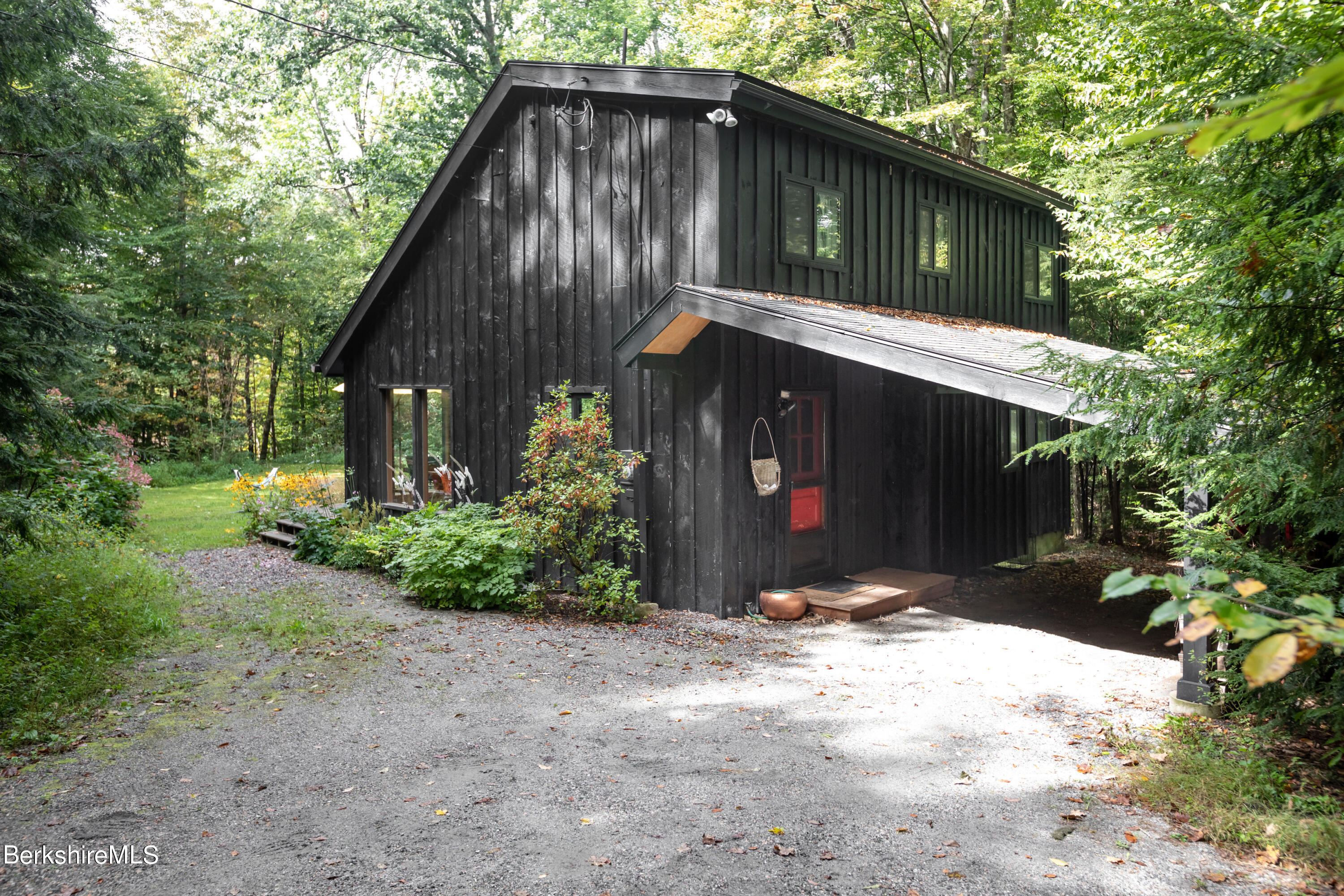 60 New Hartford Road Sandisfield, MA 01255 - Photo 4 of 25 a front view of a house with a yard