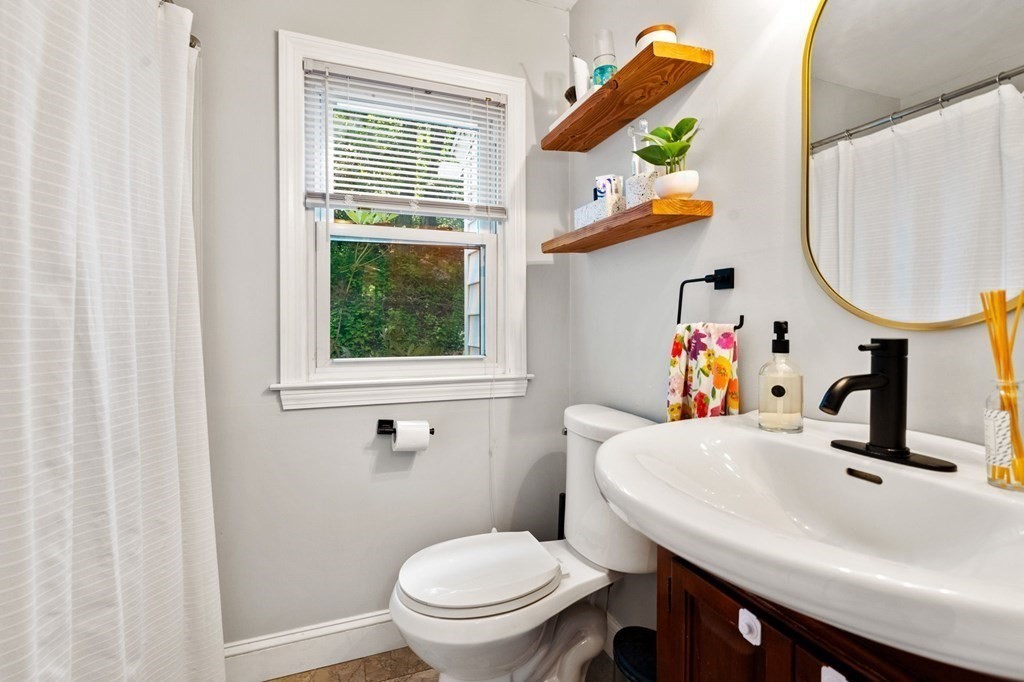 70 Indian Hill Road Worcester, MA 01606 - Photo 14 of 34 a bathroom with a sink a toilet and a mirror
