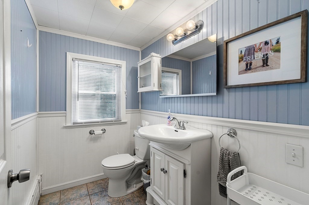 70 Indian Hill Road Worcester, MA 01606 - Photo 17 of 34 a bathroom with a toilet sink and mirror