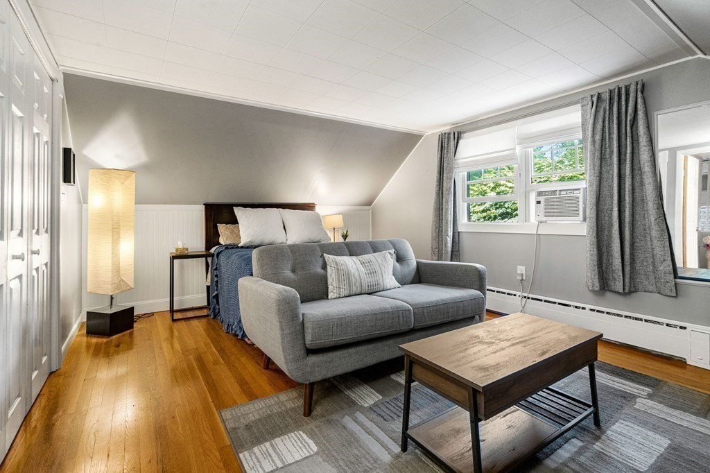70 Indian Hill Road Worcester, MA 01606 - Photo 18 of 34 a living room with furniture and a flat screen tv