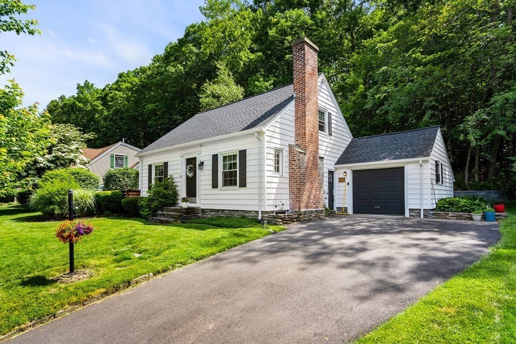 70 Indian Hill Road Worcester, MA 01606 - Photo 2 of 34 a view of a white house with a yard and large tree