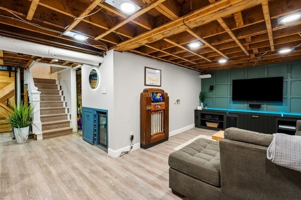 70 Indian Hill Road Worcester, MA 01606 - Photo 24 of 34 a living room with furniture and a flat screen tv