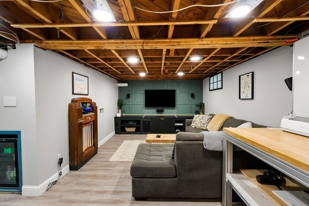 70 Indian Hill Road Worcester, MA 01606 - Photo 25 of 34 a living room with furniture and a flat screen tv