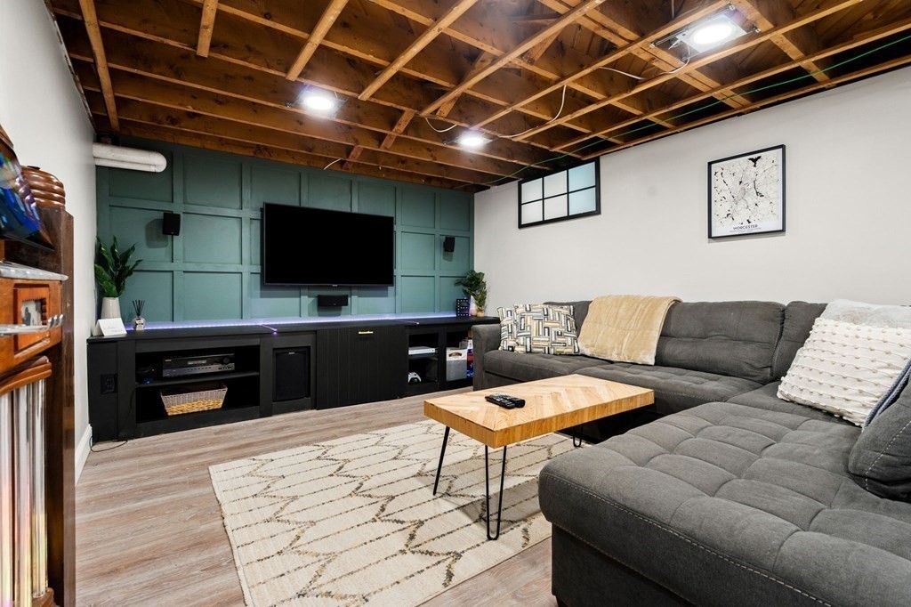 70 Indian Hill Road Worcester, MA 01606 - Photo 27 of 34 a living room with furniture and a flat screen tv