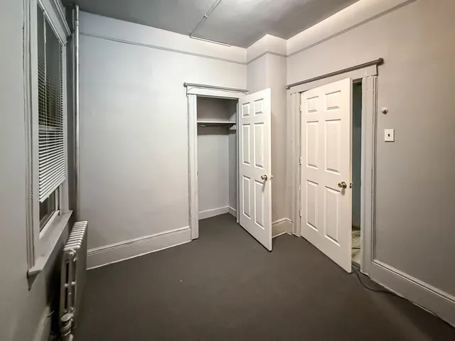 a view of empty room with windows