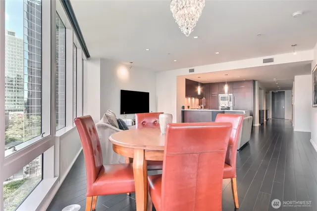 a view of a dining room with furniture window and wooden floor