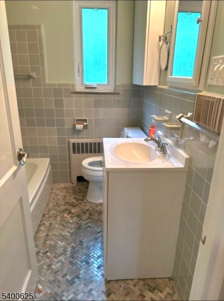 12 Troy Drive, Unit B Springfield, NJ 07081 - Photo 6 of 6 a bathroom with a sink toilet and mirror