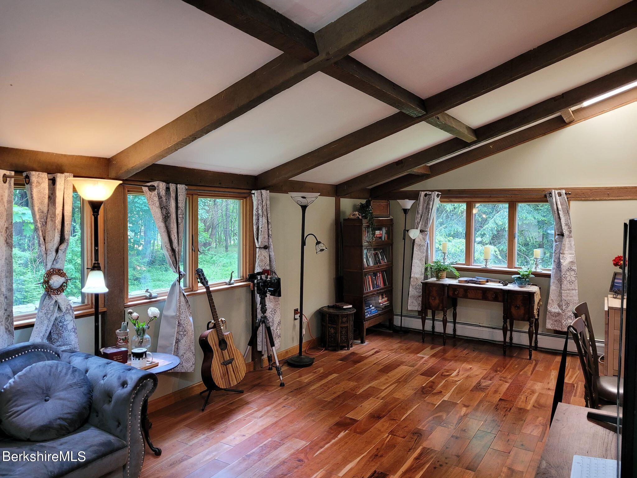 106 Access Road Becket, MA 01223 - Photo 18 of 43 a living room with furniture and large windows