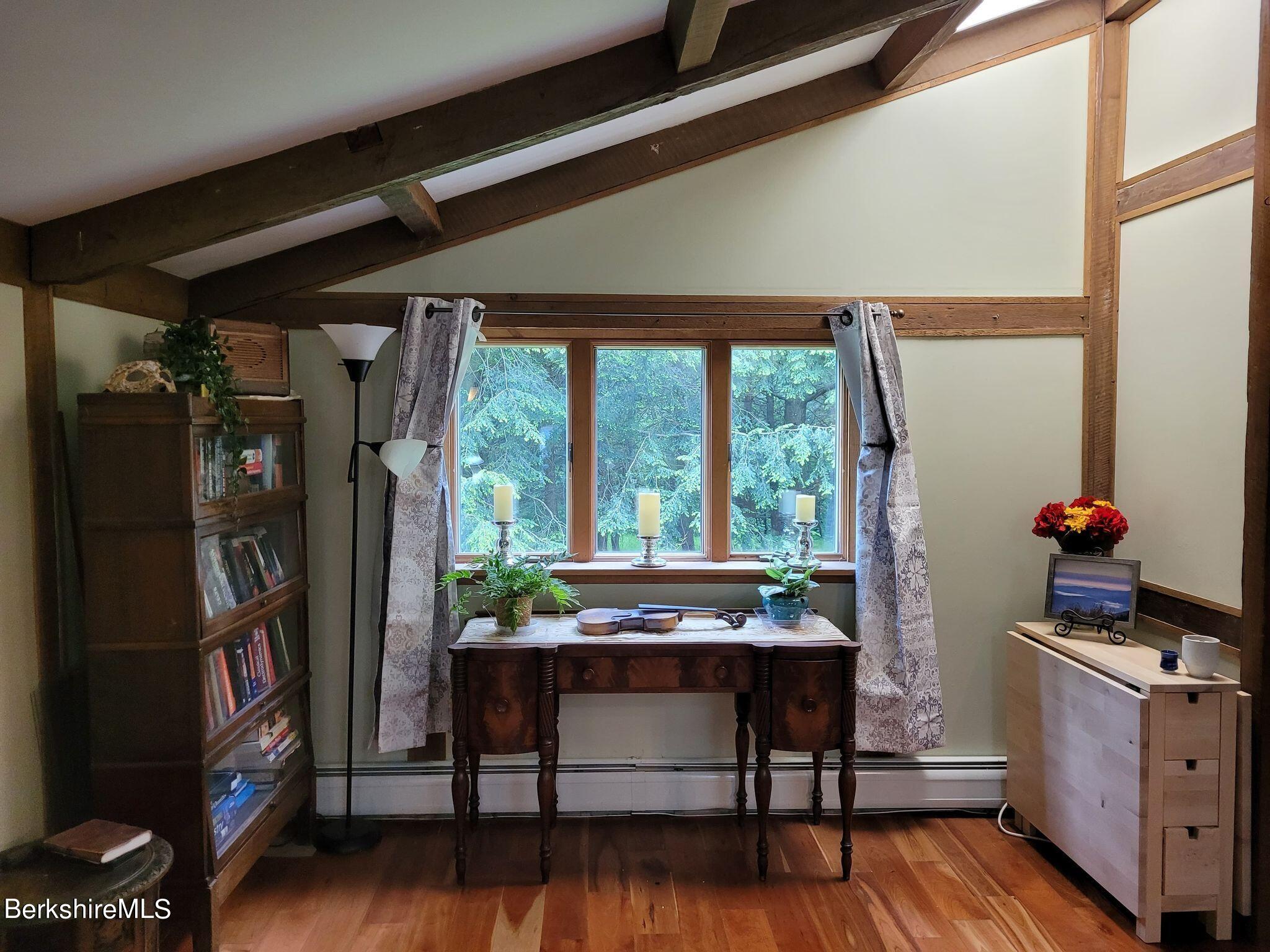 106 Access Road Becket, MA 01223 - Photo 21 of 43 a room with furniture and a potted plant