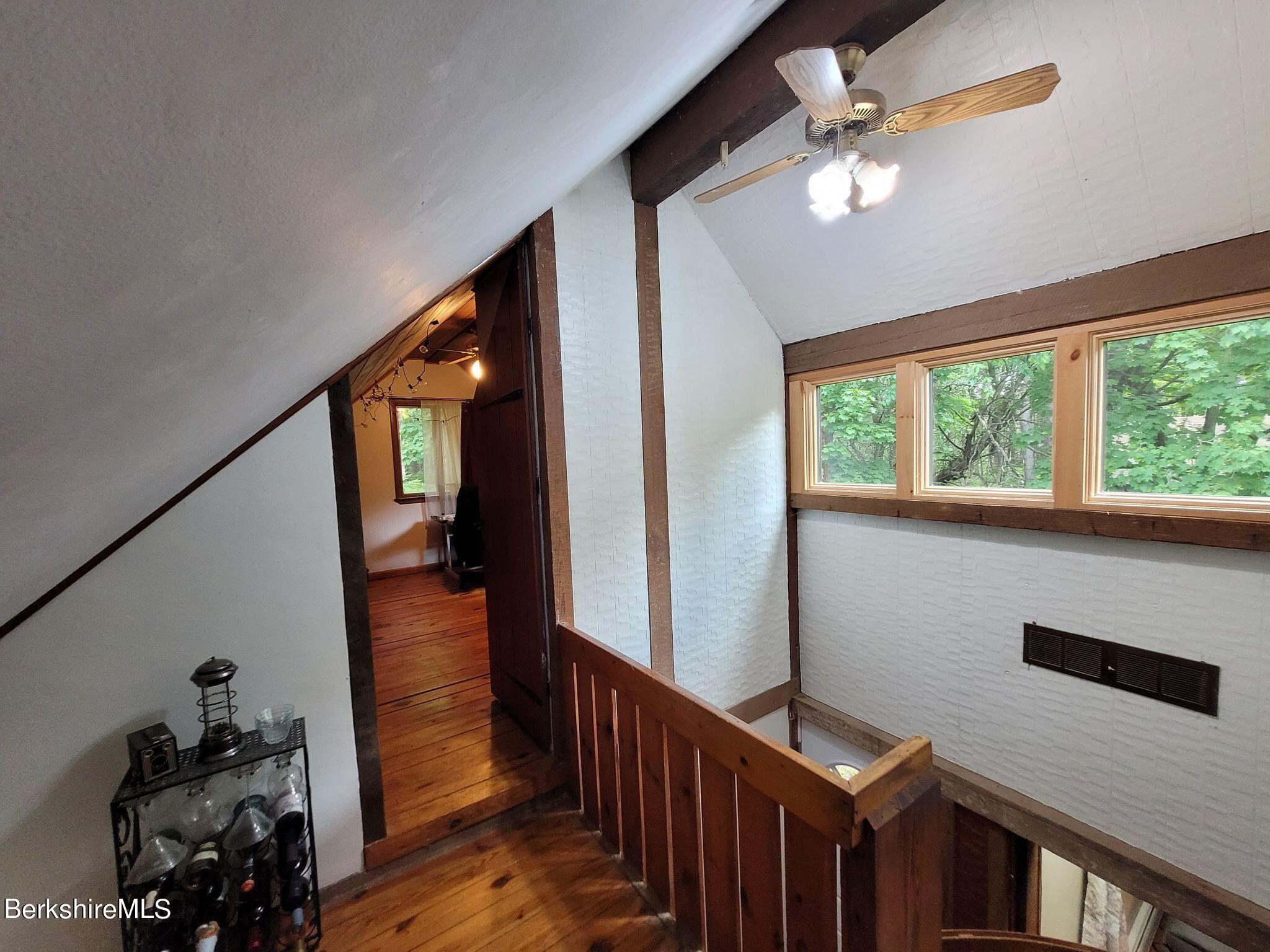 106 Access Road Becket, MA 01223 - Photo 24 of 43 a view of a hallway with wooden floor and workspace