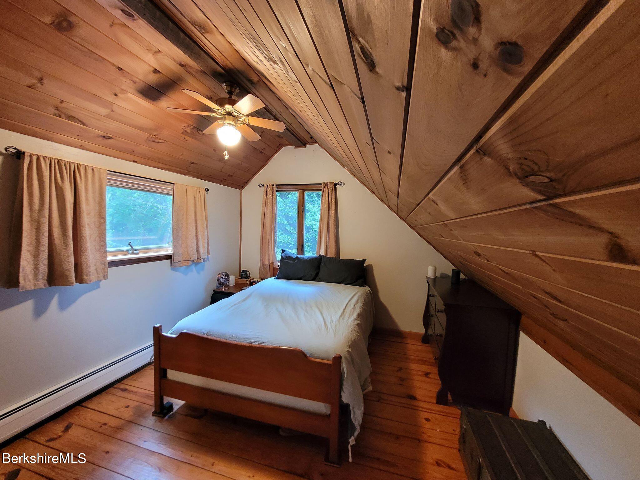 106 Access Road Becket, MA 01223 - Photo 25 of 43 a bedroom with furniture and a window