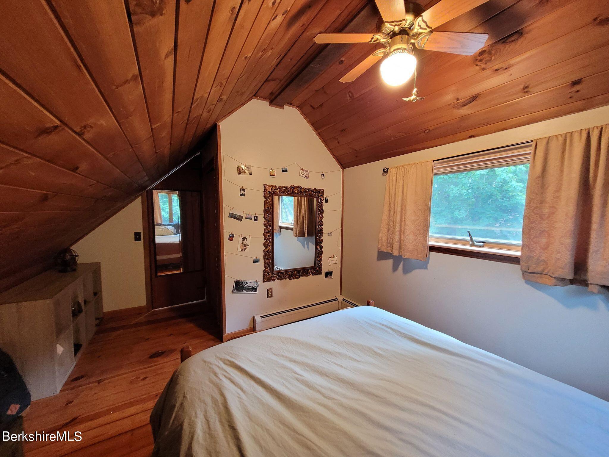 106 Access Road Becket, MA 01223 - Photo 26 of 43 a bed room with a bed and a large window