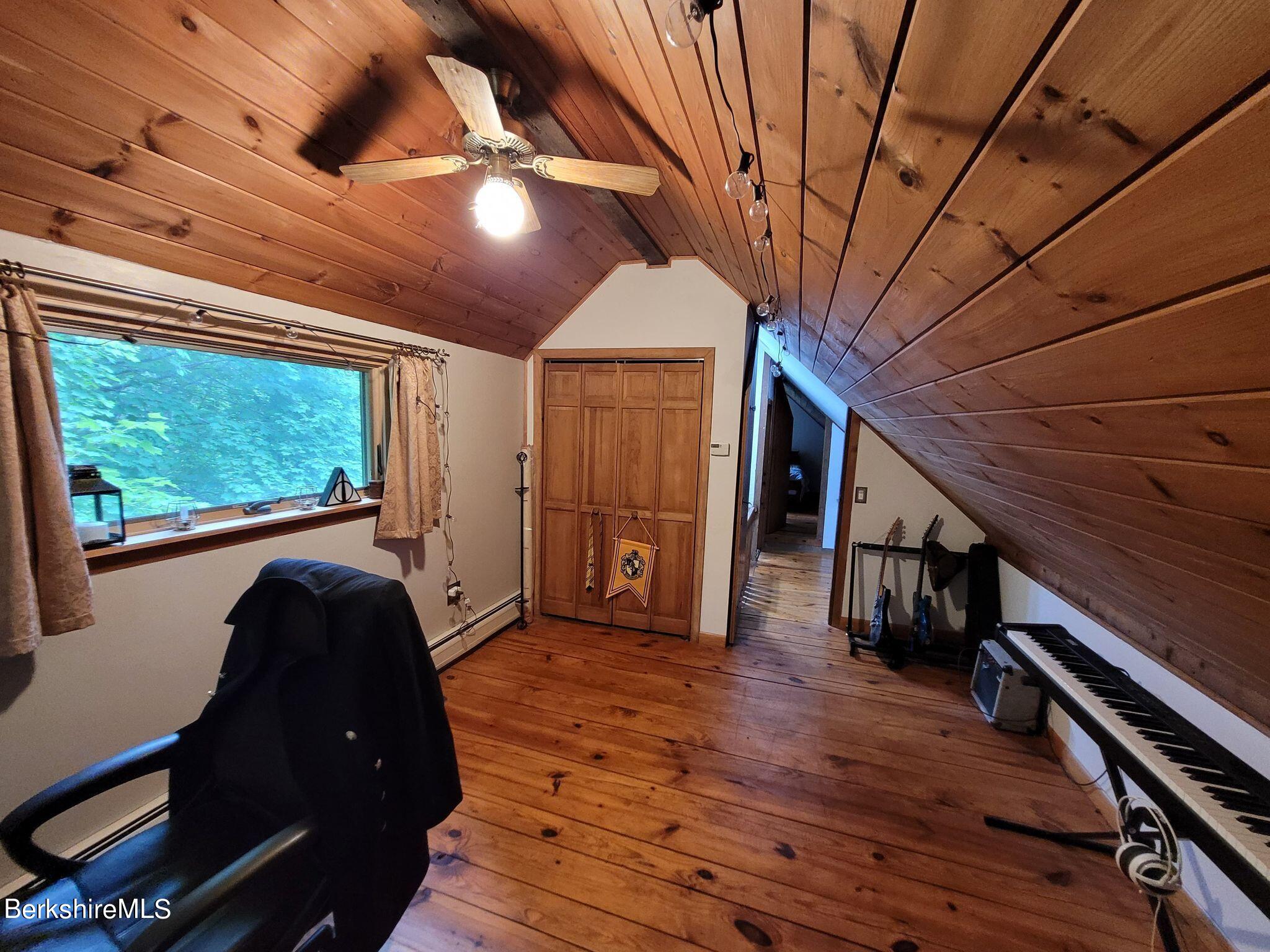 106 Access Road Becket, MA 01223 - Photo 28 of 43 a living room with wooden floors and furniture