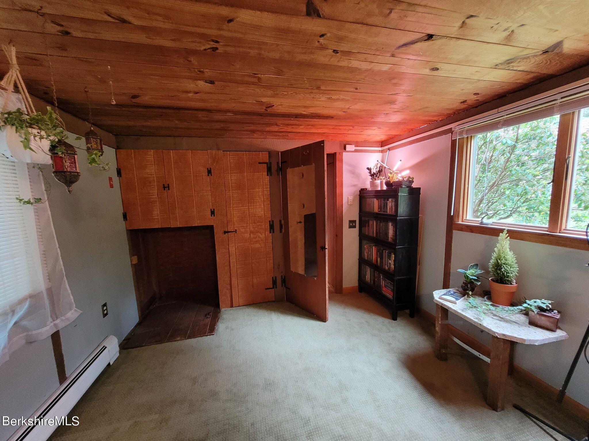106 Access Road Becket, MA 01223 - Photo 30 of 43 a view of a room with lots of windows