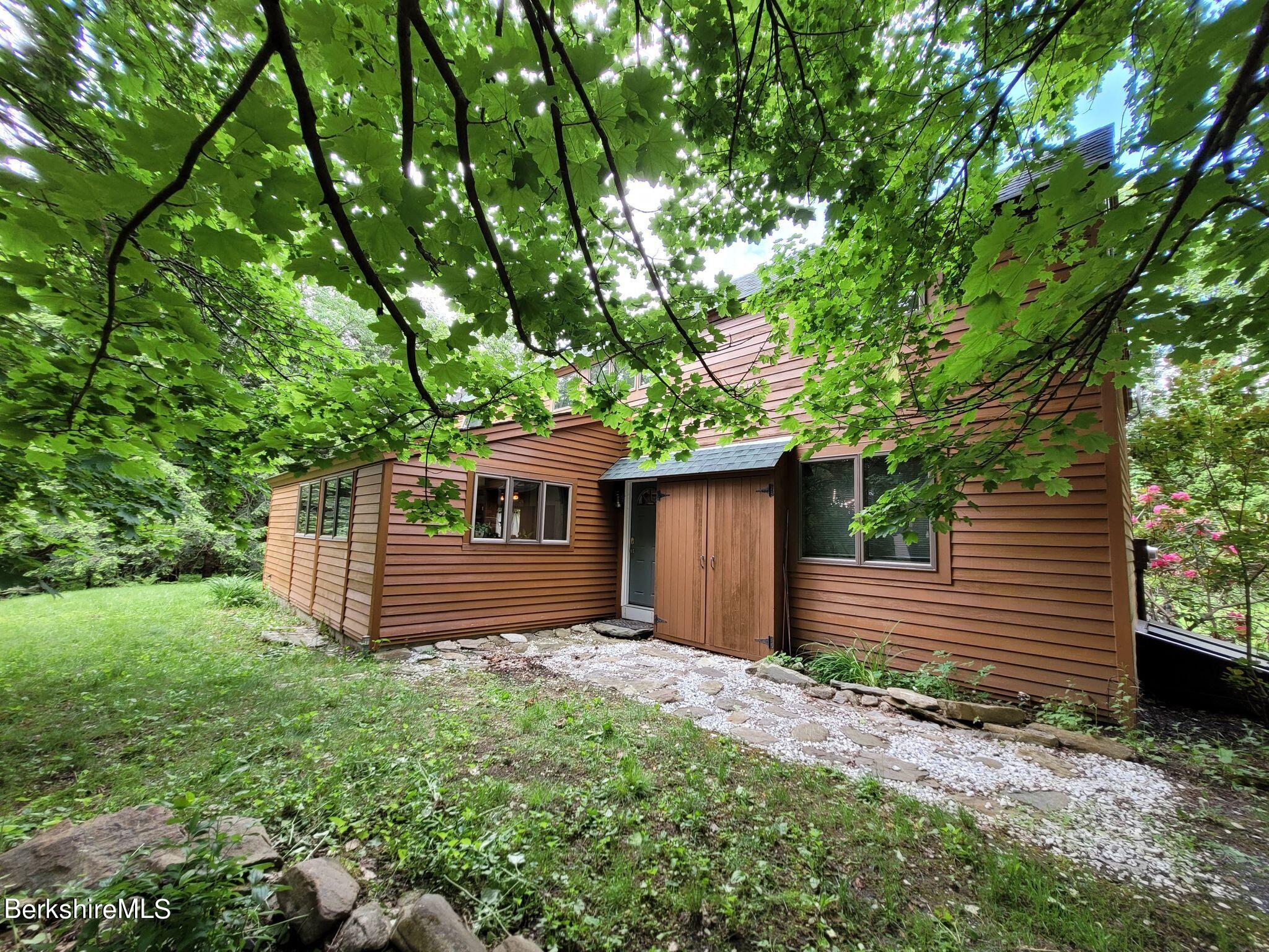 106 Access Road Becket, MA 01223 - Photo 3 of 43 a view of a house with a yard