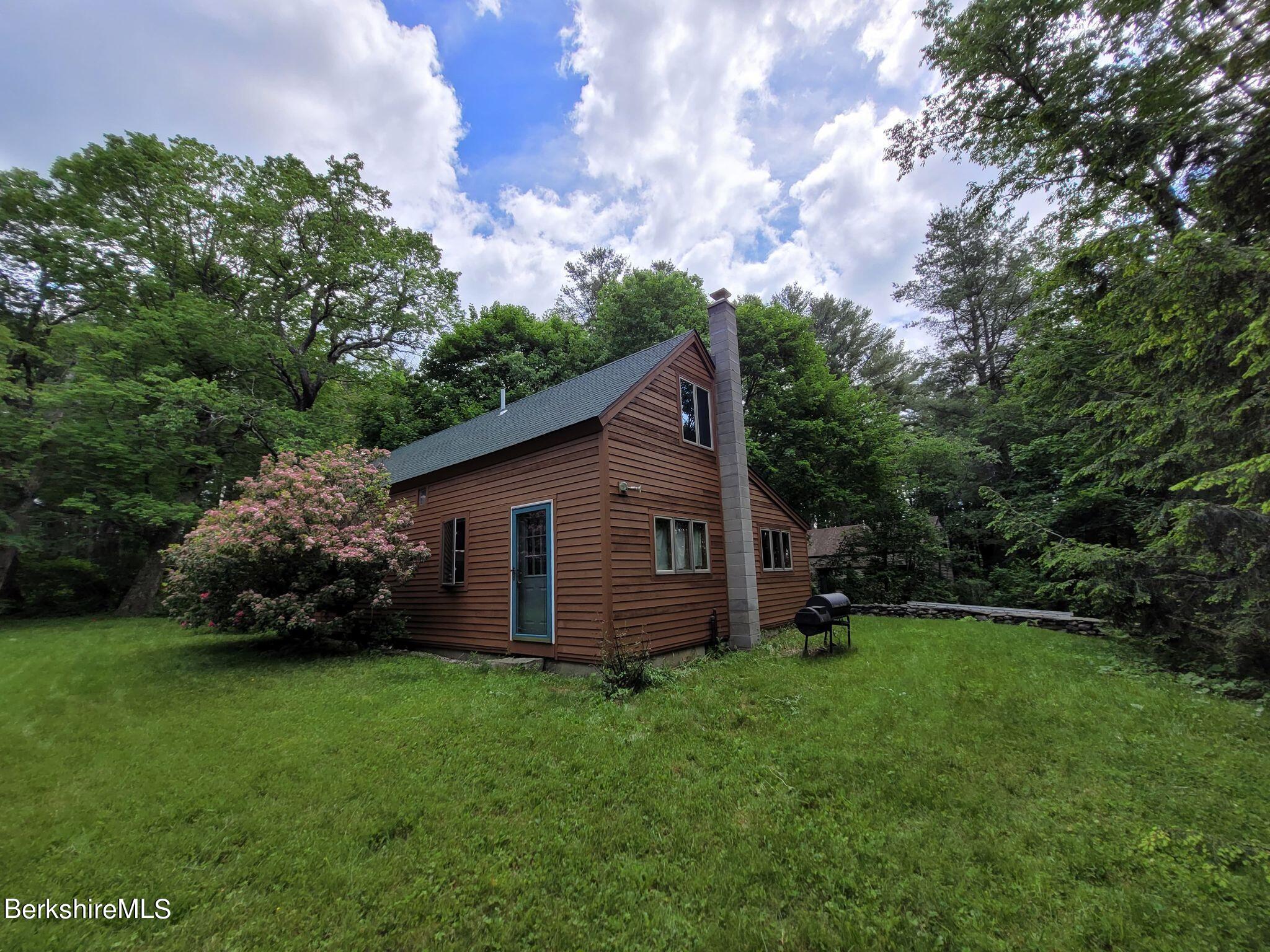106 Access Road Becket, MA 01223 - Photo 5 of 43 a backyard of a house with lots of green space