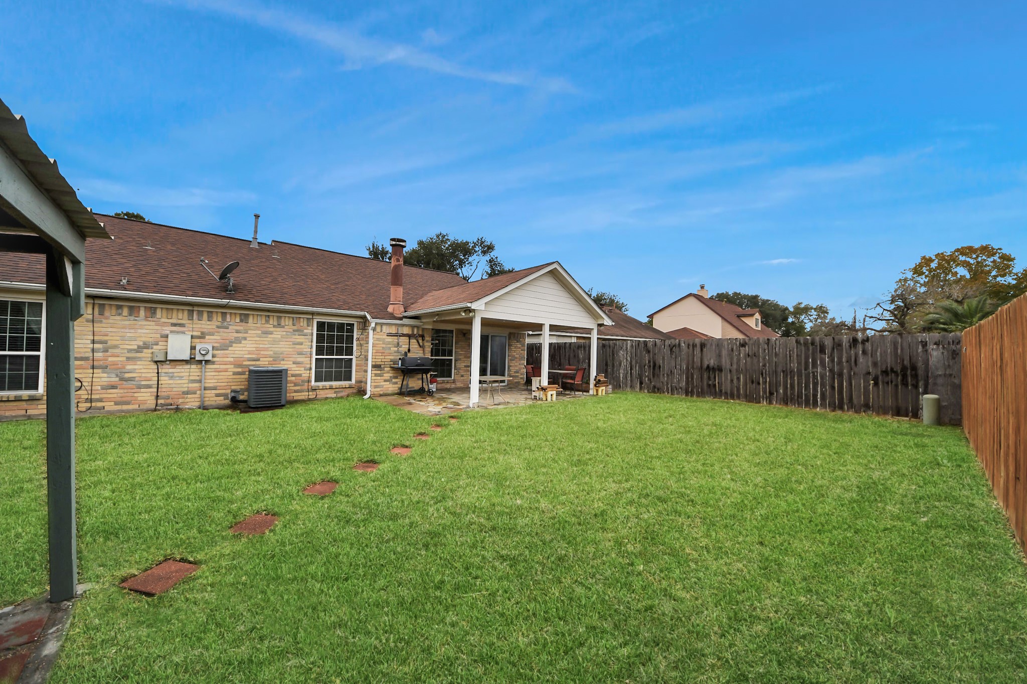 17702 Poppy Trails Lane Houston, TX 77084 - Photo 34 of 37 Follow the brick road to find your second covered patio!