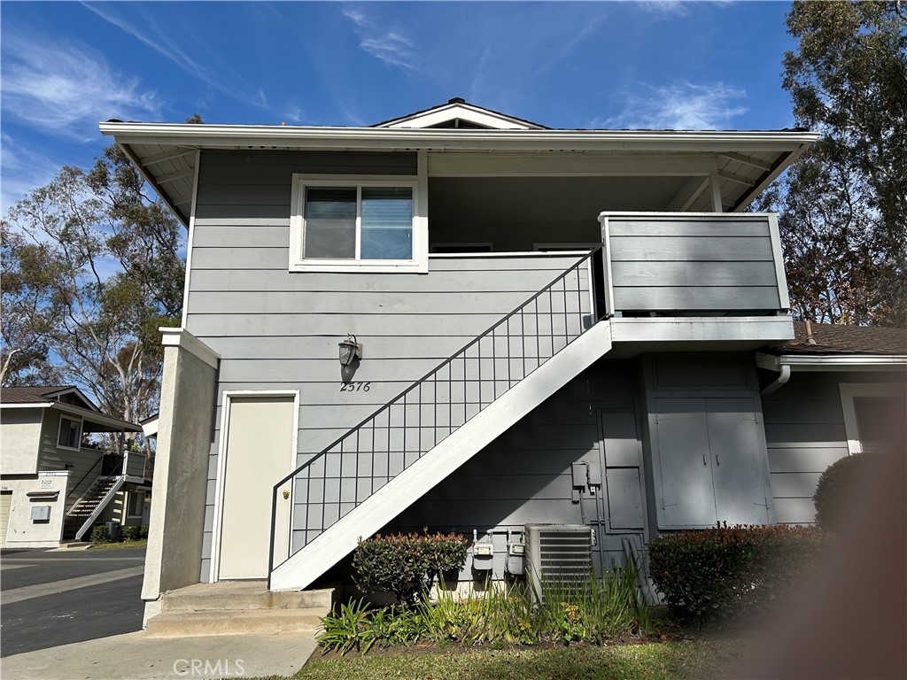 2576 Coventry Circle Fullerton, CA 92833 - Photo 1 of 15 a front view of a house with garage