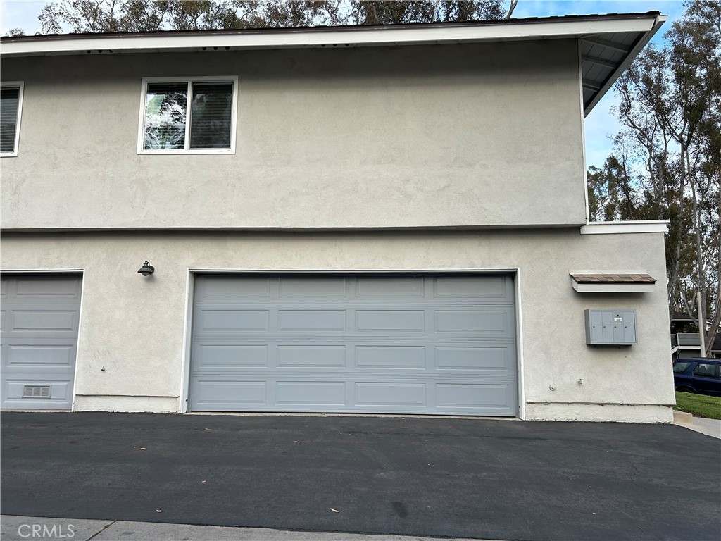 2576 Coventry Circle Fullerton, CA 92833 - Photo 11 of 15 a front view of a house with a garage