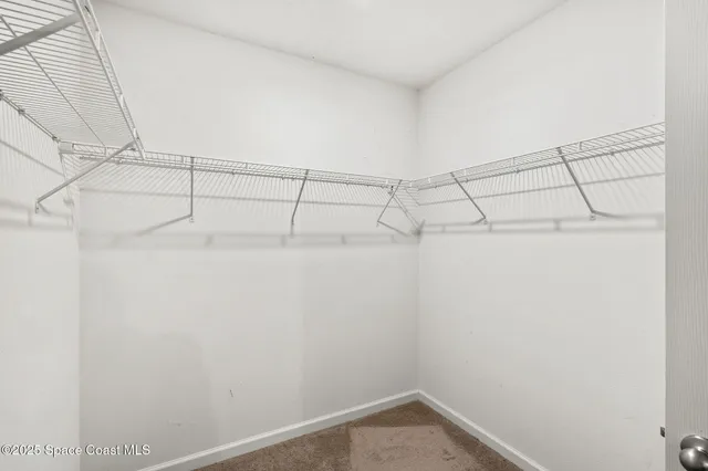 a view of a room with racks on the wall