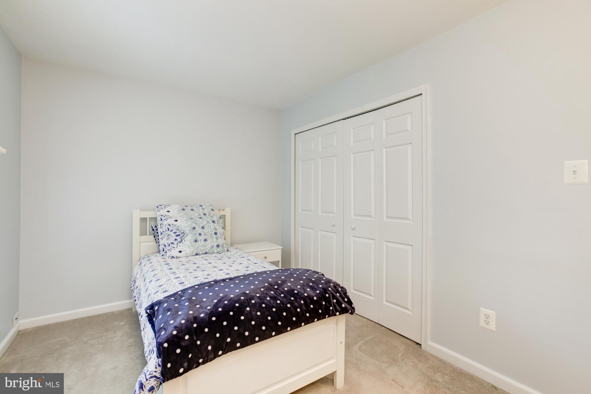 326 Riding Ridge Road Annapolis, MD 21403 - Photo 39 of 63 a bedroom with a bed and a window