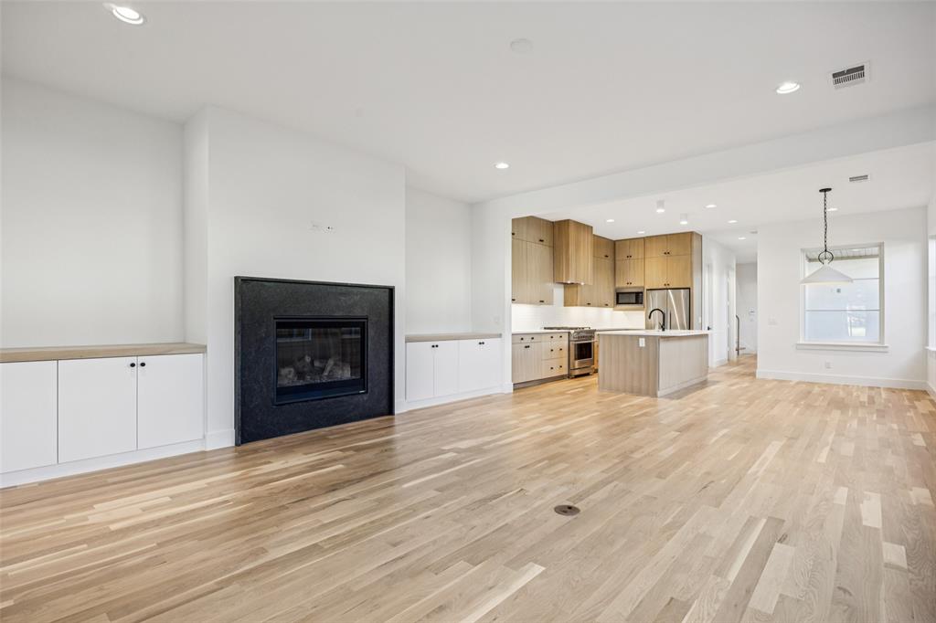 5600 Ellsworth Avenue Dallas, TX 75206 - Photo 15 of 31 a view of a kitchen with a sink and a fireplace