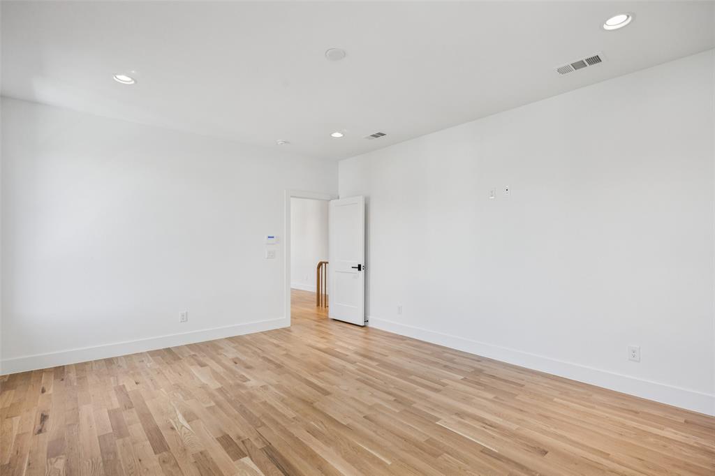 5600 Ellsworth Avenue Dallas, TX 75206 - Photo 22 of 31 an empty room with wooden floor
