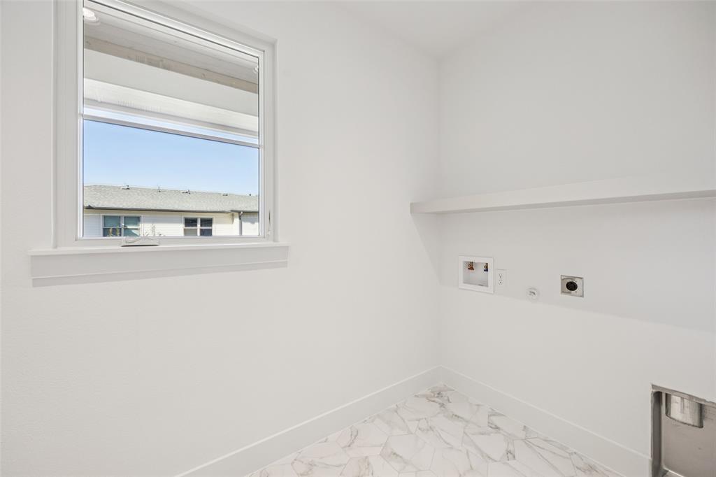 5600 Ellsworth Avenue Dallas, TX 75206 - Photo 30 of 31 a view of a bathroom with a window
