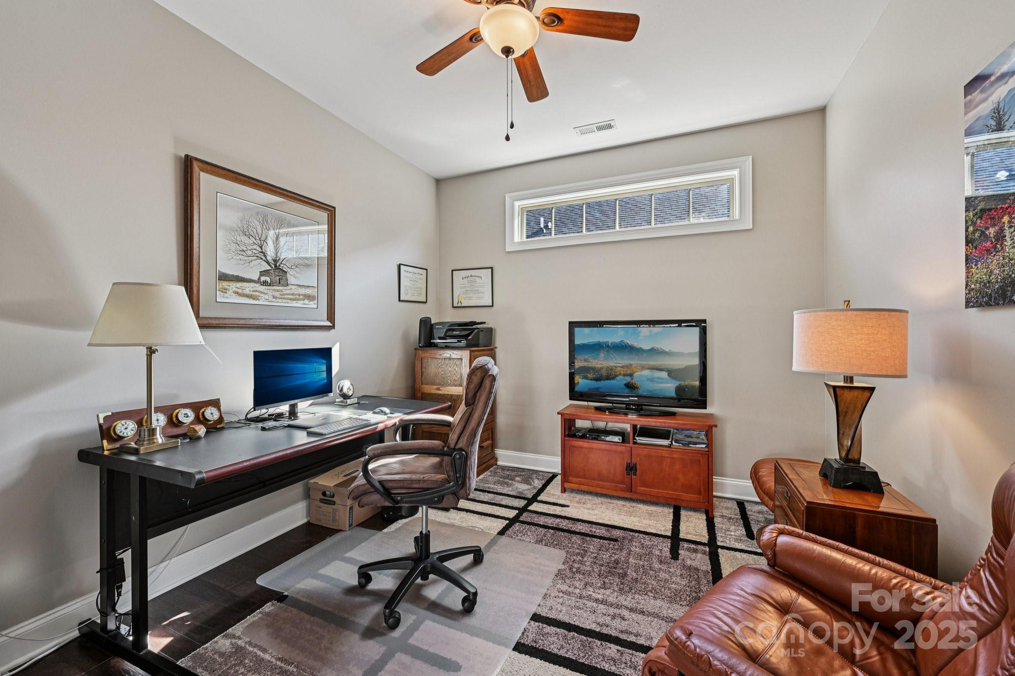 1293 Restoration Drive Waxhaw, NC 28173 - Photo 12 of 41 a work room with furniture and a lamp