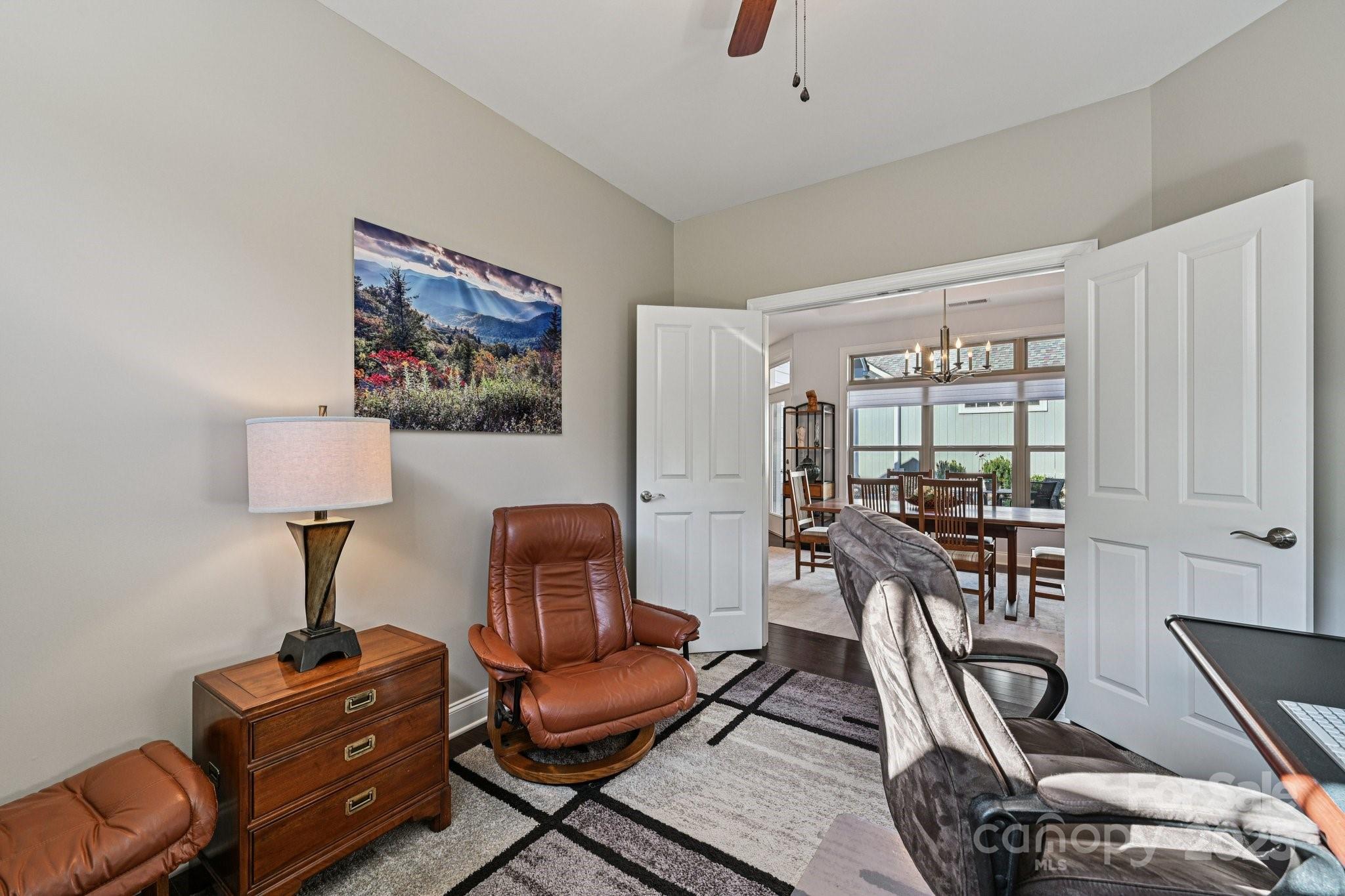 1293 Restoration Drive Waxhaw, NC 28173 - Photo 13 of 41 a view of a workspace with furniture and lounge chair