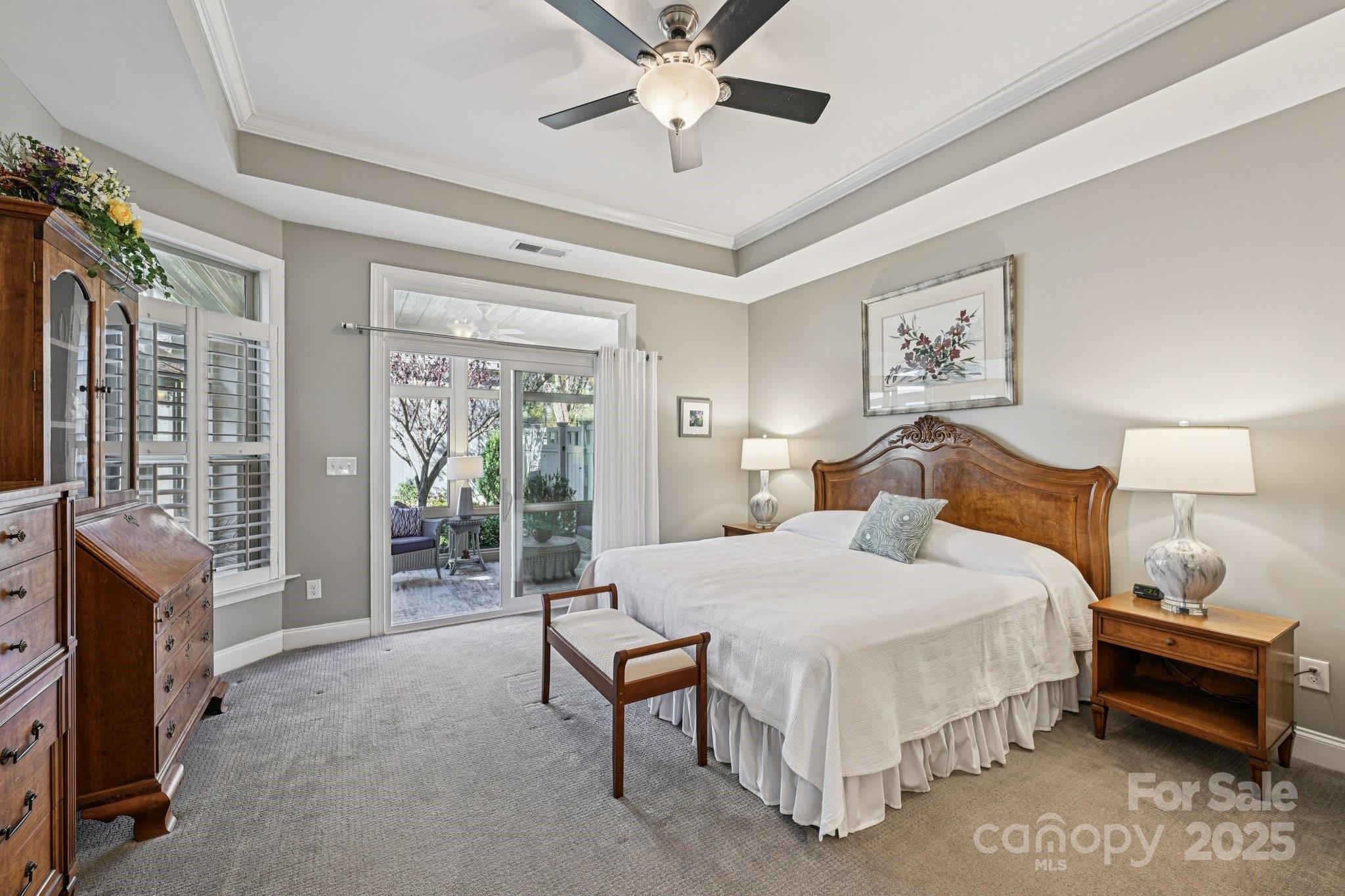 1293 Restoration Drive Waxhaw, NC 28173 - Photo 14 of 41 a bedroom with a bed and a chandelier