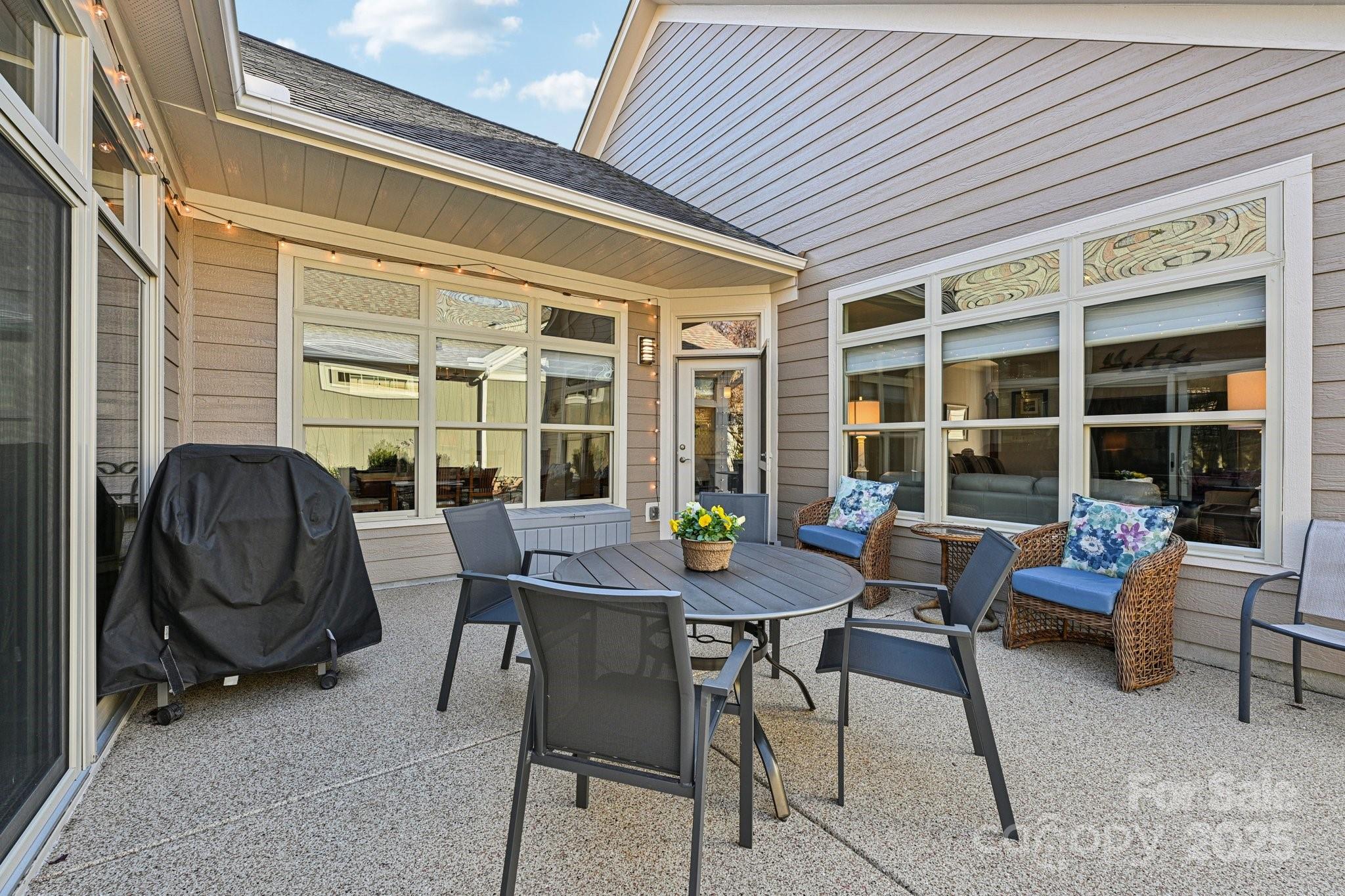 1293 Restoration Drive Waxhaw, NC 28173 - Photo 27 of 41 a view of a patio with a table and chairs