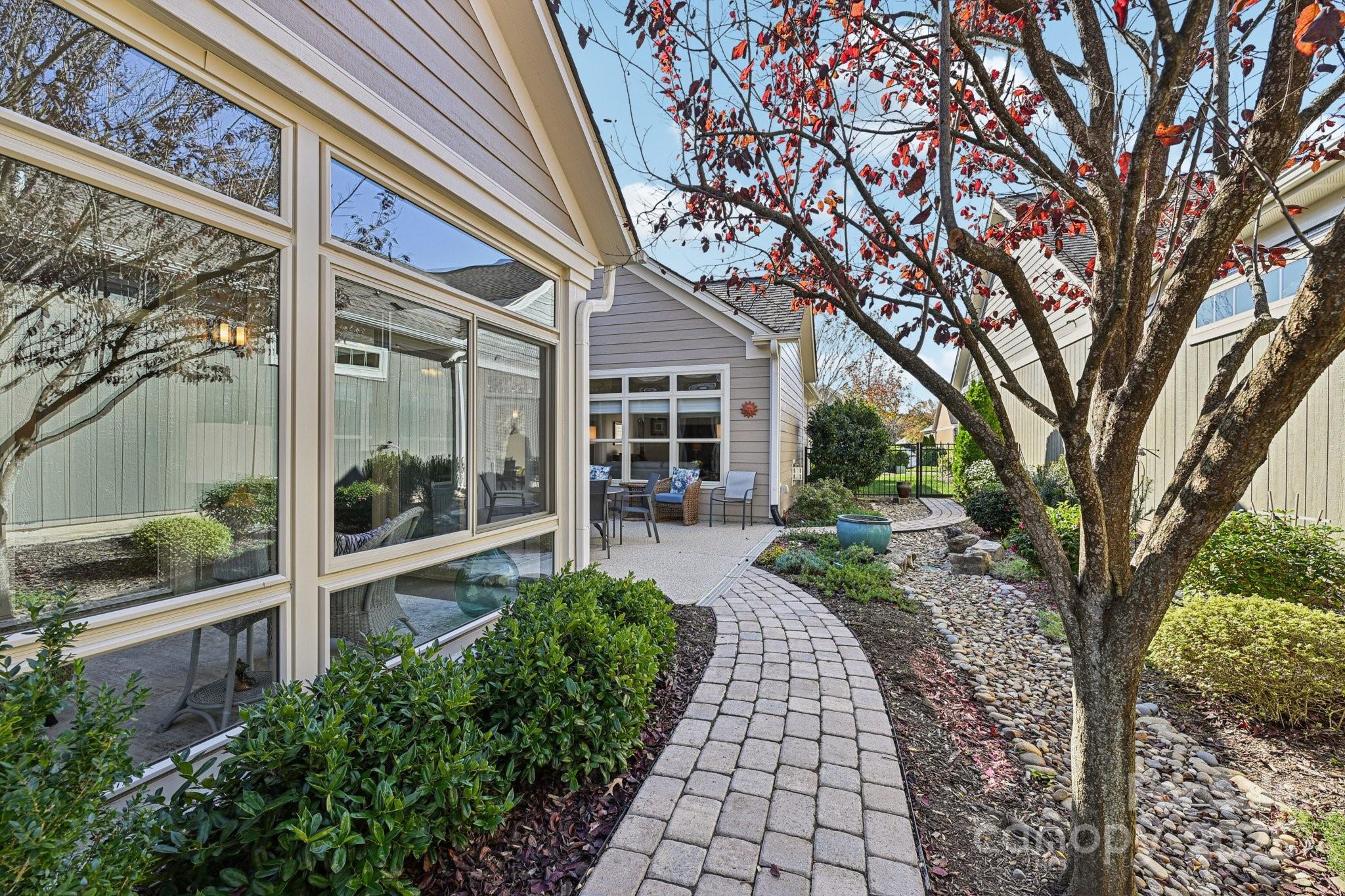 1293 Restoration Drive Waxhaw, NC 28173 - Photo 31 of 41 a front view of a house with a garden