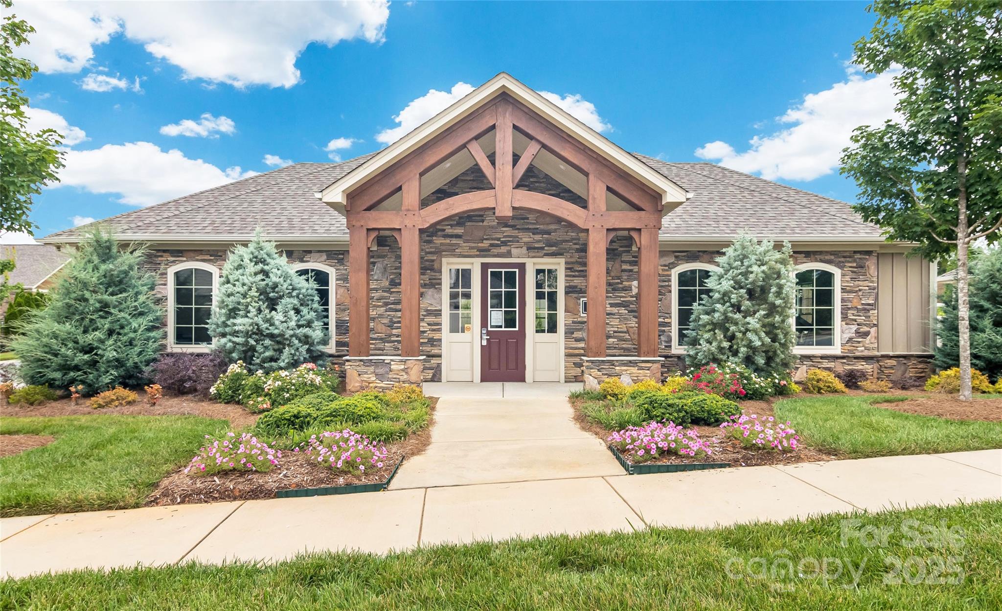1293 Restoration Drive Waxhaw, NC 28173 - Photo 35 of 41 a front view of a house with garden