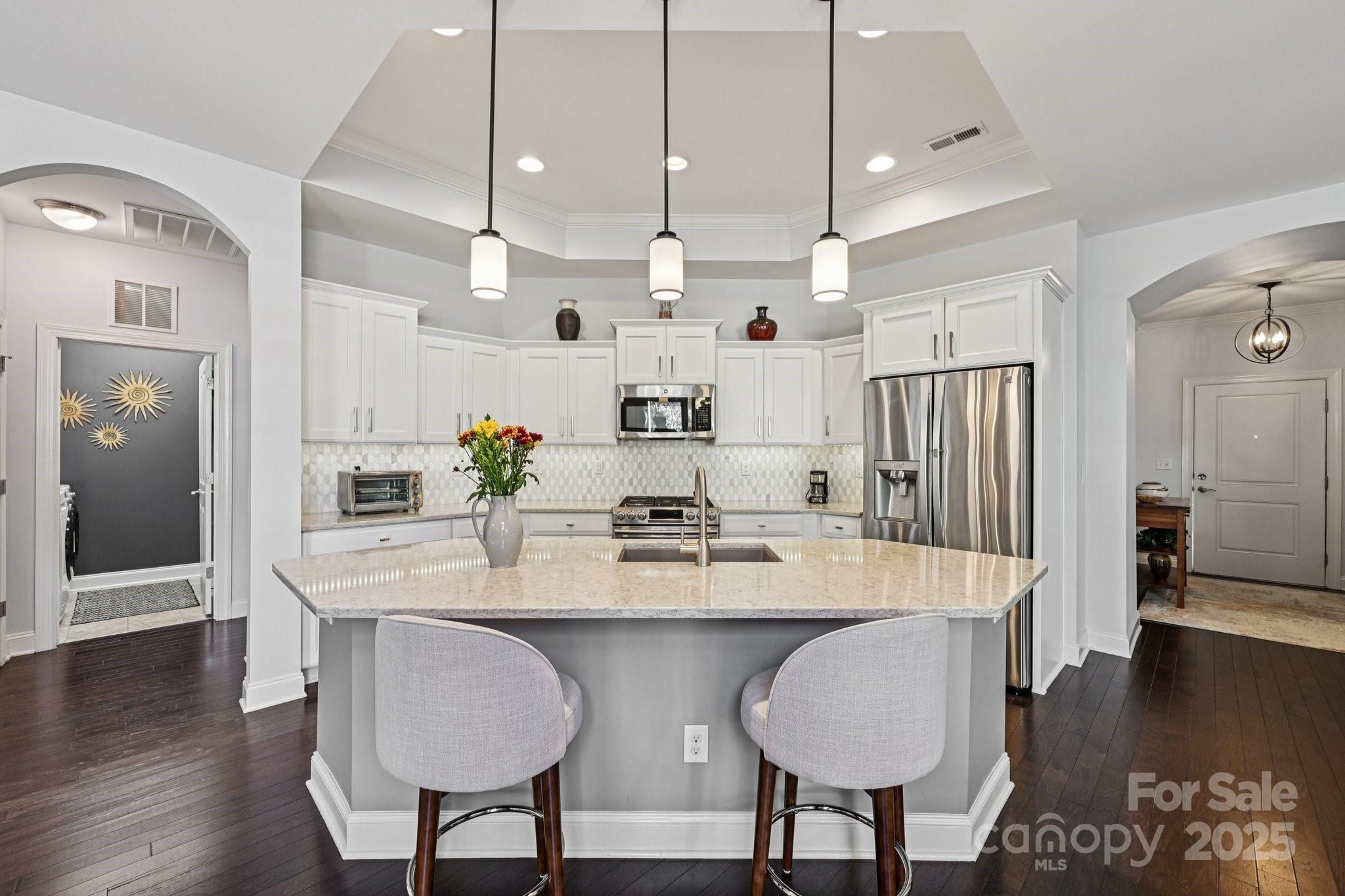 1293 Restoration Drive Waxhaw, NC 28173 - Photo 7 of 41 a large kitchen with kitchen island a table and chairs