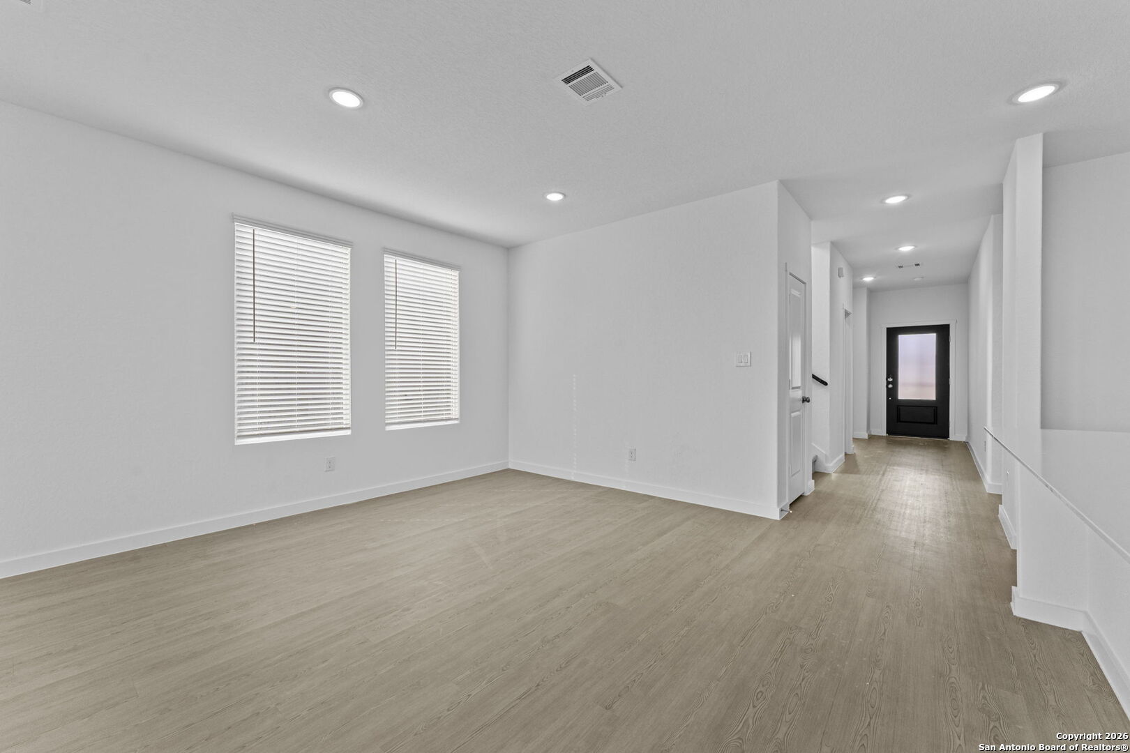1859 Nuthatch Ridge New Braunfels, TX 78130 - Photo 13 of 34 an empty room with a natural light and windows