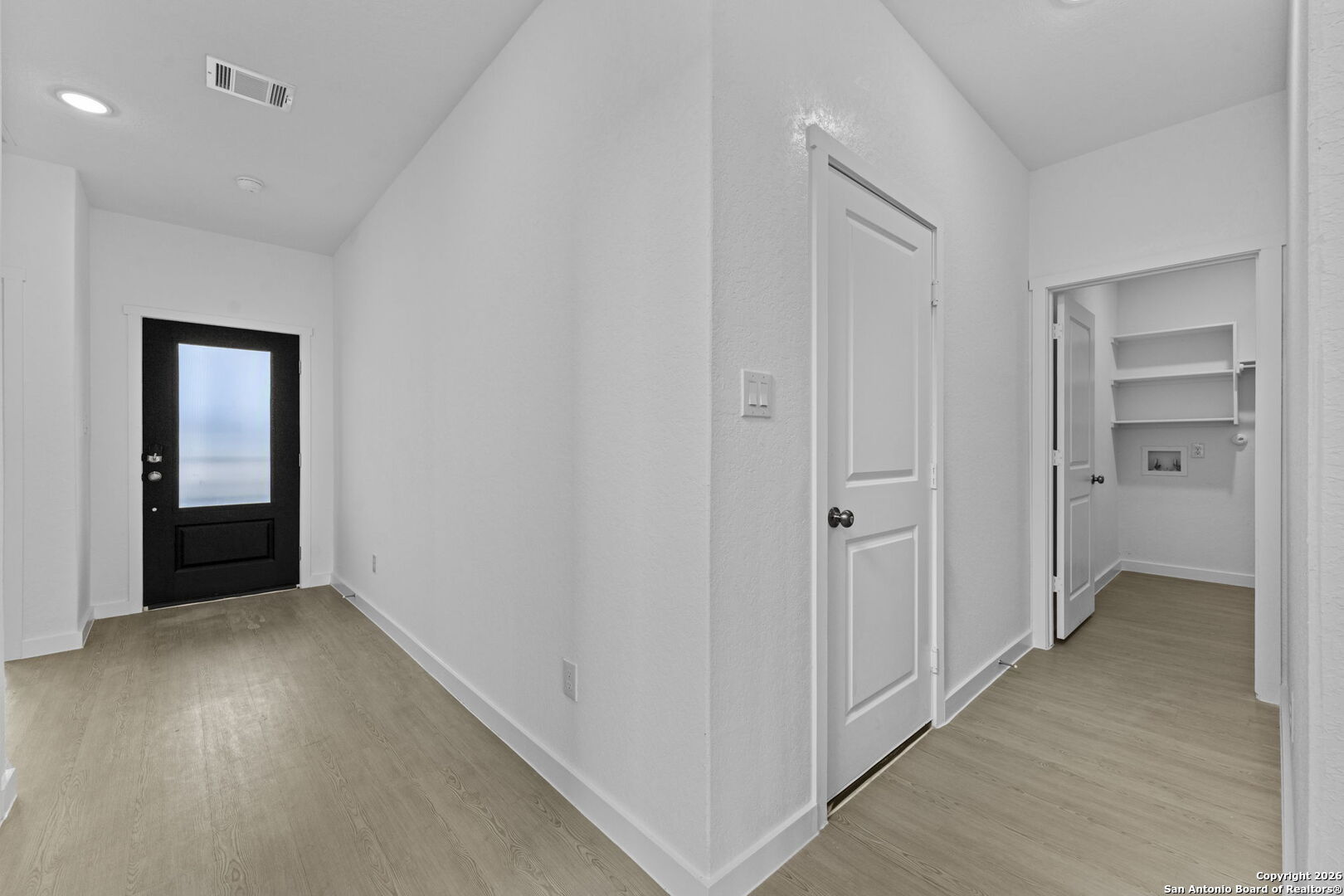 1859 Nuthatch Ridge New Braunfels, TX 78130 - Photo 8 of 34 wooden floor in a hall with an entryway