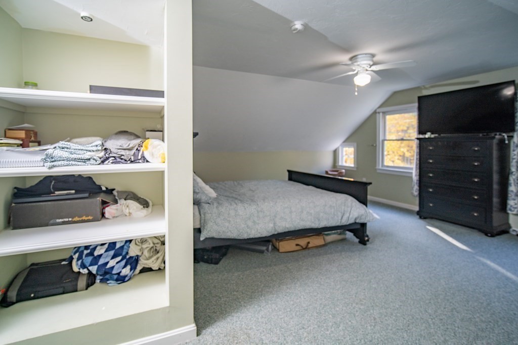 151 Fuller Street Middleboro, MA 02346 - Photo 11 of 24 a bedroom with a bed and flat tv screen on dresser