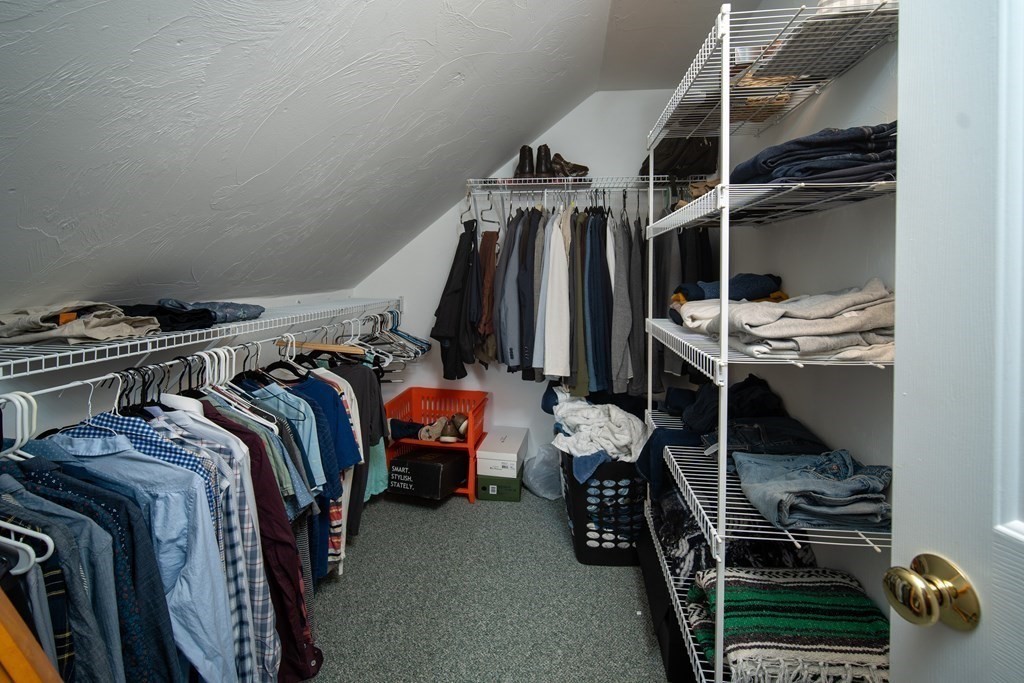 151 Fuller Street Middleboro, MA 02346 - Photo 12 of 24 a view of walk in closet with clothes and shoes
