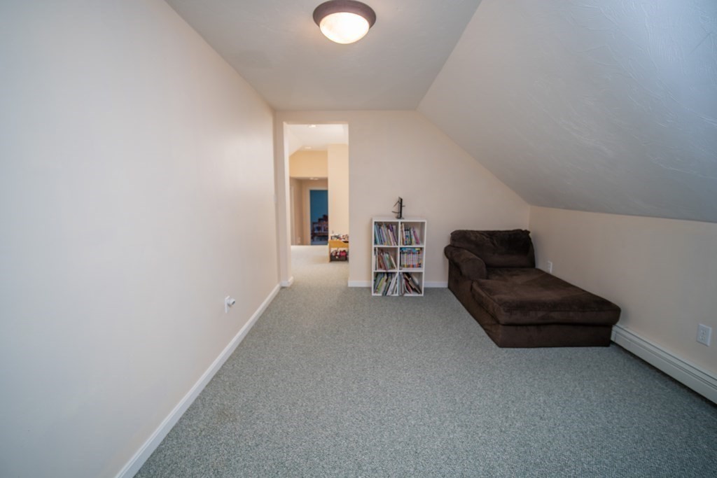 151 Fuller Street Middleboro, MA 02346 - Photo 13 of 24 a living room with furniture and a chair